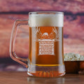 Glass beer mug filled with beer, sand-carved with an eagle perched on a scroll bearing the full text of the Second Amendment.