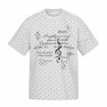 Light gray relaxed tee with allover micro hearts and gothic script graphic on the chest