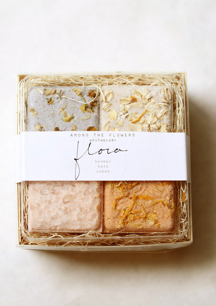 A boxed set of four bath cubes.