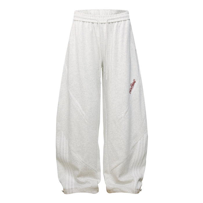 Light heather gray wide leg sweatpants with curved panel seams and small side script logo