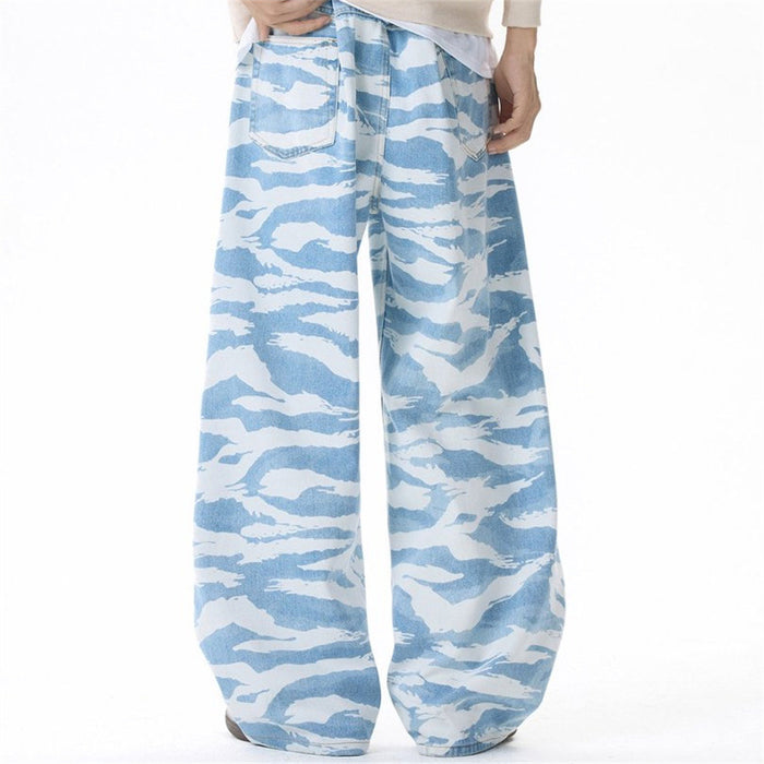Model view of light blue zebra camo wide-leg jeans with oversized legs