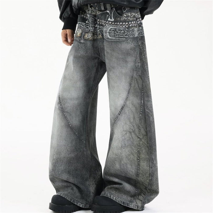 Angled front view of baggy grey wide-leg jeans with contrasting paisley waistband graphics