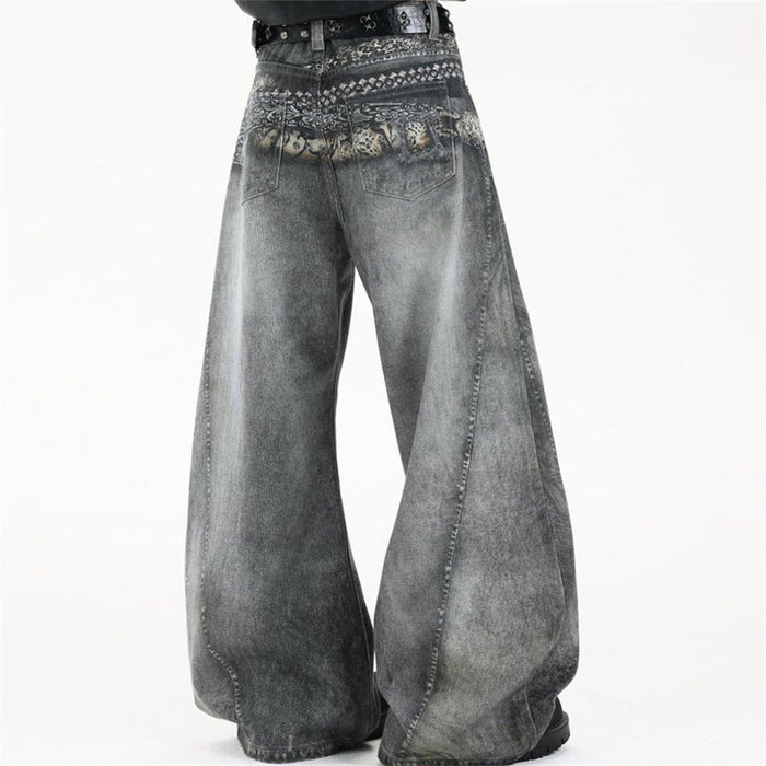 Rear angled view of acid-washed grey wide-leg jeans with a patterned graphic waistband