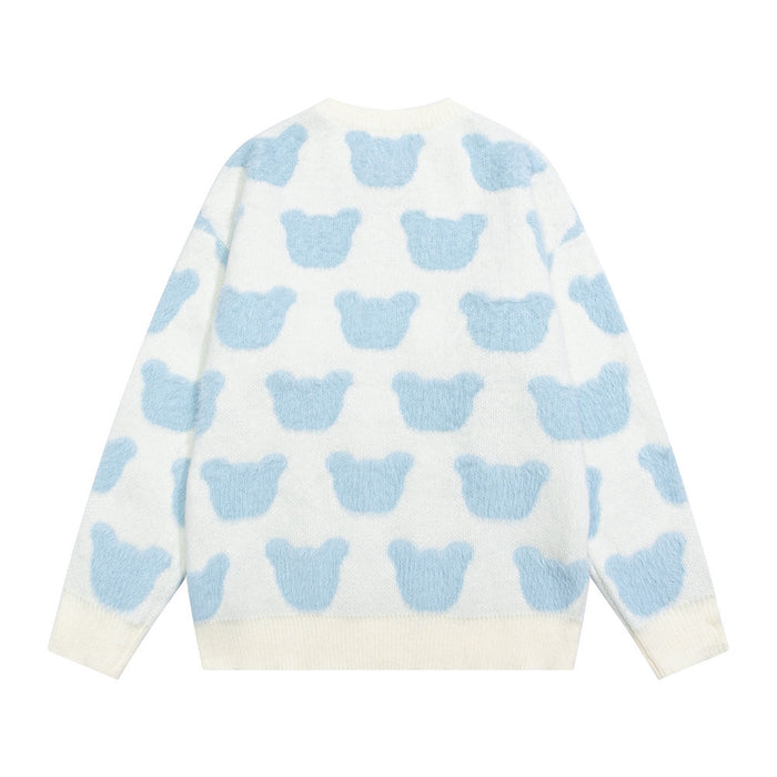 Cream knit sweater shown from the back with repeating light blue bear motifs and ribbed cuffs and hem