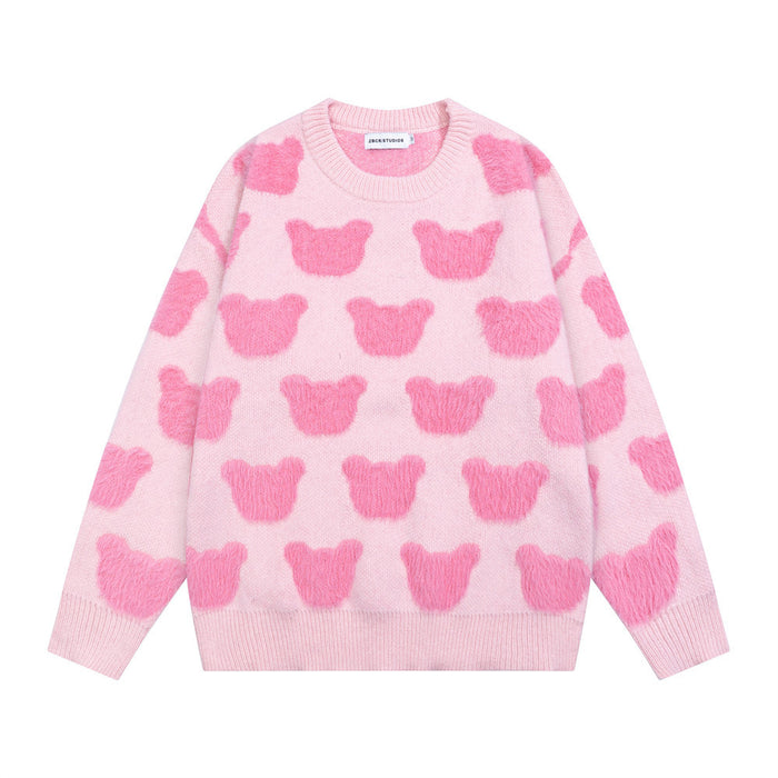Pink crewneck knit sweater shown from the front with repeating darker pink bear motifs and ribbed trim