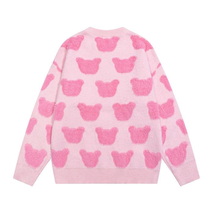 Pink knit sweater shown from the back with repeating darker pink bear motifs and ribbed cuffs and hem