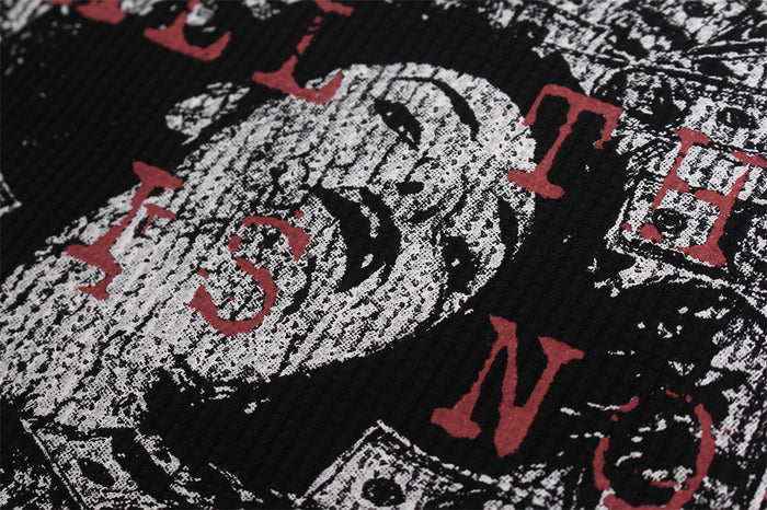 Close-up of distressed red and white lettering layered over a black-and-white illustrated graphic