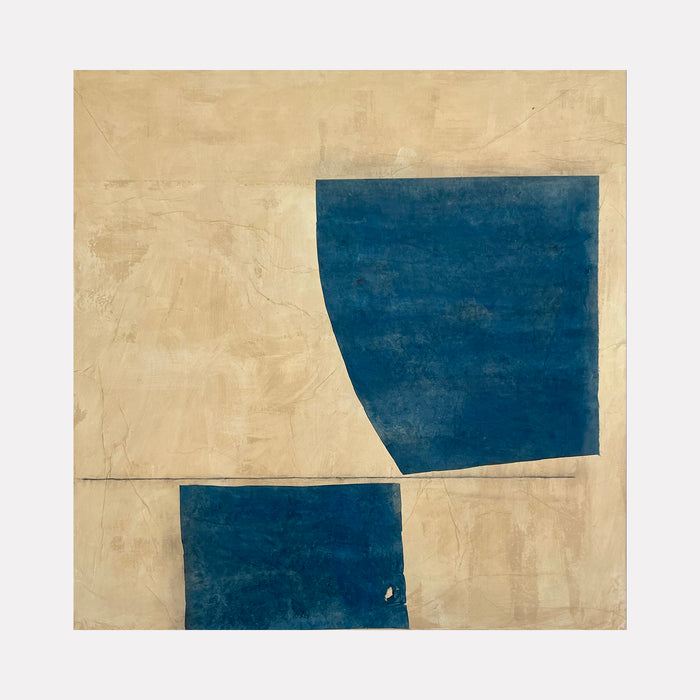 The artwork 'Blue on Buff II' by Diane Englander features two bold geometric deep blue shapes set against a textured buff-colored canvas. The composition is minimalist, with a clean horizontal line dividing the space and creating a striking contrast between the angular blue forms and the warm, textured background, executed in papers, pencil and acrylic on canvas.