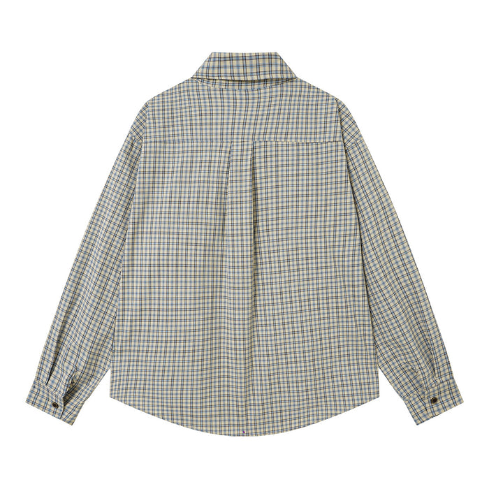 Light blue and cream plaid shirt shown from the back with a yoke seam and curved hem