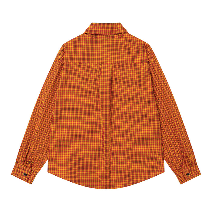 Orange and yellow plaid shirt shown from the back with a pleated yoke and curved hem