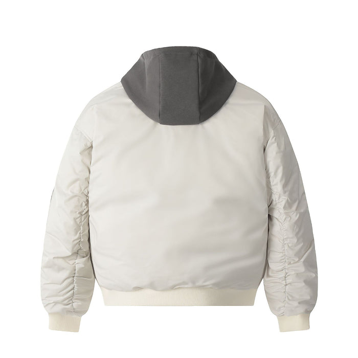 Cream padded bomber jacket shown from the back with a dark gray hood and ribbed hem and cuffs