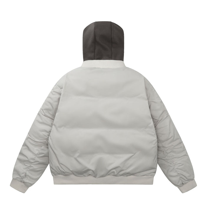 Cream padded bomber jacket shown from the back with a raised dark gray hood and ribbed hem