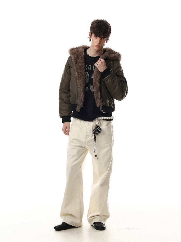 Full-length model view of an olive green bomber jacket with faux fur hood lining, front zipper and ribbed waistband