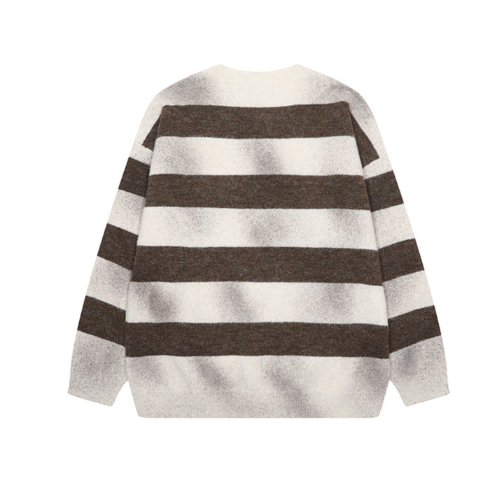 Back view of a brown and cream striped knit sweater with long sleeves and ribbed hem