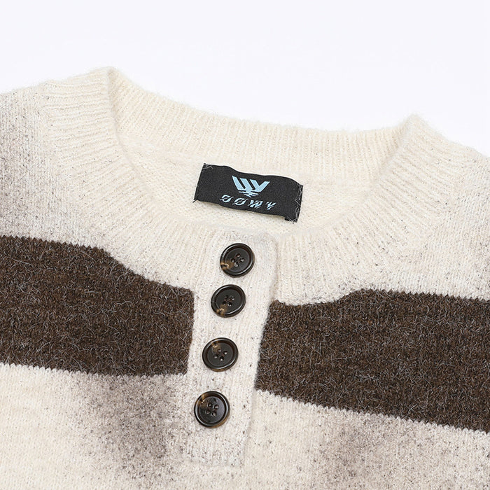 Close-up of the cream ribbed Henley neckline with four dark buttons on the striped knit sweater
