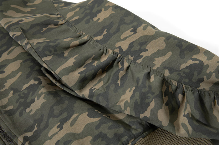 Close-up of the bomber jacket sleeve showing gathered pleats and camouflage fabric construction