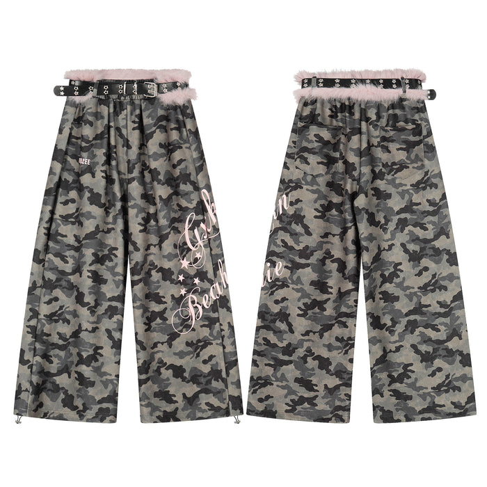 Front and back view of wide-leg camouflage pants with pink faux fur waist trim, black studded belt, and pink gothic lettering