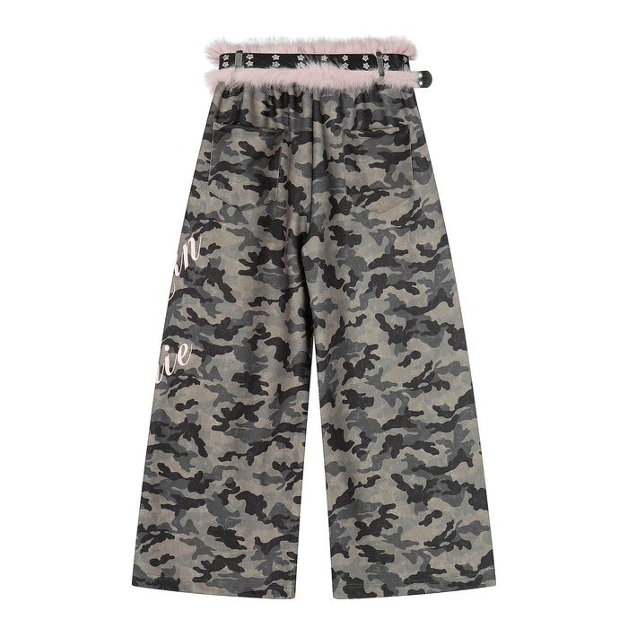 Back view of wide-leg camo pants with pink faux fur trim, studded belt, and back pockets