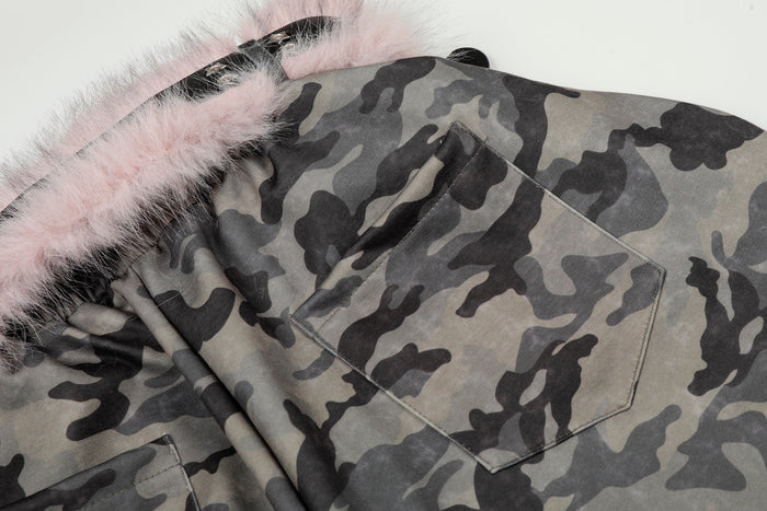 Close-up of camo pants back pocket and pink faux fur waistband trim