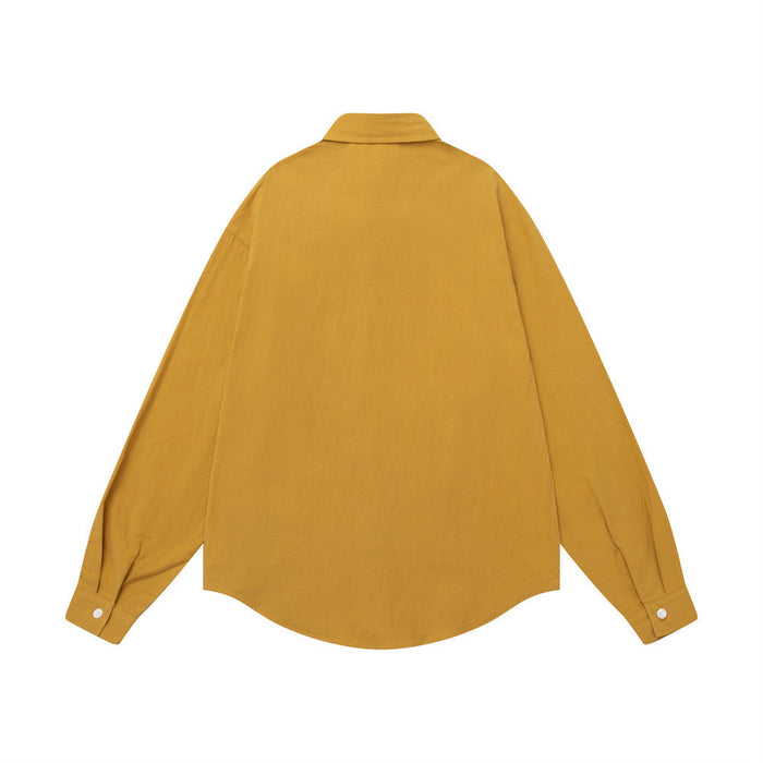 Back view of the ochre and charcoal colorblock button-down shirt with a plain ochre back and long sleeves