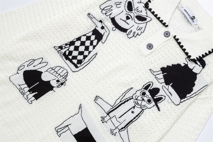 Close-up of the cream sweater front showing multiple black-and-white cartoon dog jacquard graphics