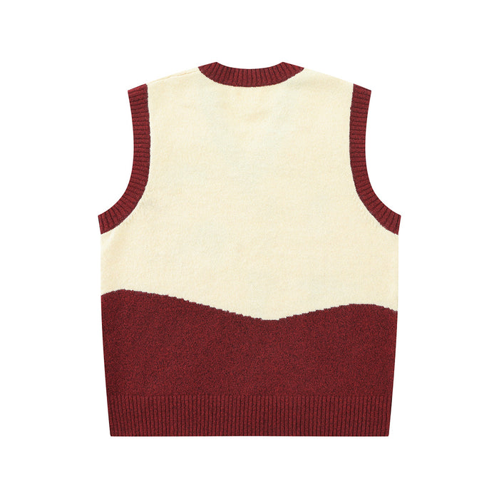 Back view of the cream and burgundy knit sweater vest with a wavy colorblock section and ribbed hem