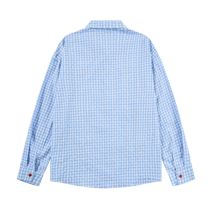 Back view of the blue gingham long sleeve shirt showing its plain checked fabric and buttoned cuffs