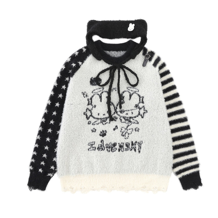 White fuzzy knit sweater with cartoon bunny graphic, black star sleeve, striped sleeve, and detachable black collar