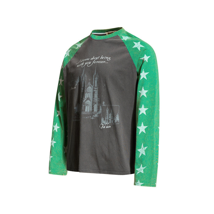 Three-quarter front view of dark gray raglan long sleeve tee with green star-print sleeves