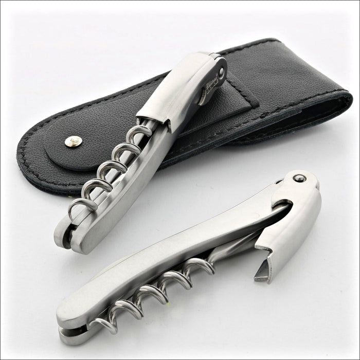 Chateau Laguiole Classic Stainless Steel Corkscrew, two angled views with black leather pouch. Handcrafted details, 100% Made in France.