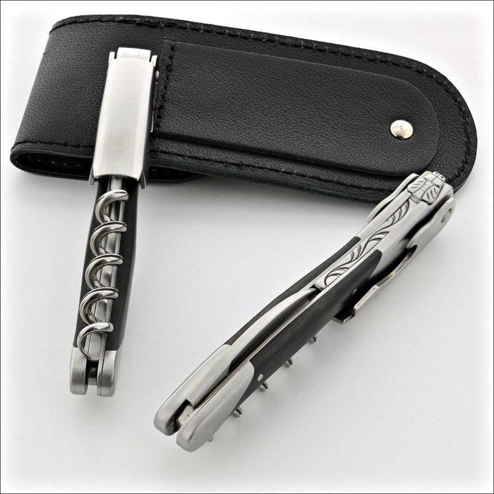 Chateau Laguiole Grand Cru Ebony Corkscrew, close-up of two corkscrews and black leather case. Handcrafted details, 100% Made in France.