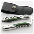 Chateau Laguiole Grand Cru Green Stamina Corkscrew, top-down view of two corkscrews with green stamina handles and a black leather case. Handcrafted details, 100% Made in France.