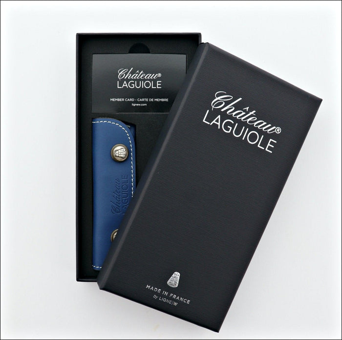 Chateau Laguiole corkscrew, blue leather case, open black gift box. Handcrafted details, 100% Made in France.