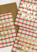 A set of red and green plaid Christmas cards.