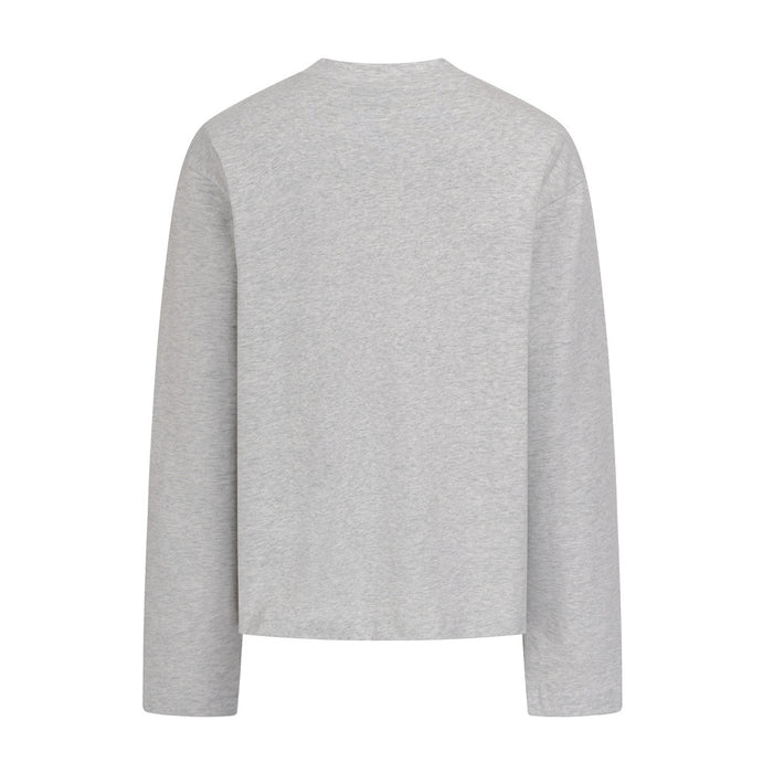 Light gray long sleeve shirt shown from the plain back with sleeves extended