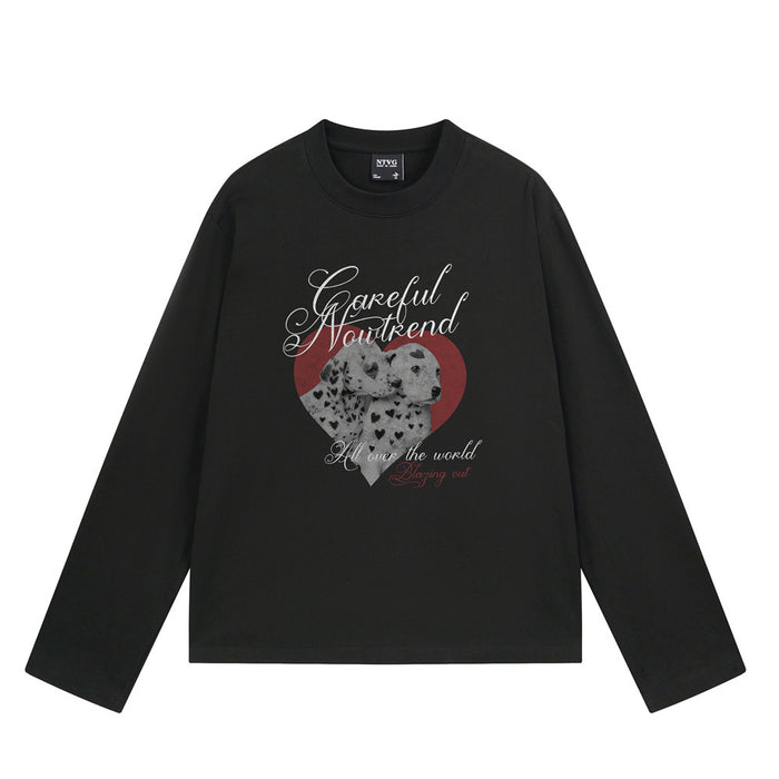 Black long sleeve shirt front with spotted puppy heart graphic and white and red script lettering