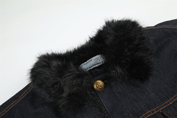 Close-up of the jacket’s plush black faux fur collar, denim fabric, label, and top gold-tone button