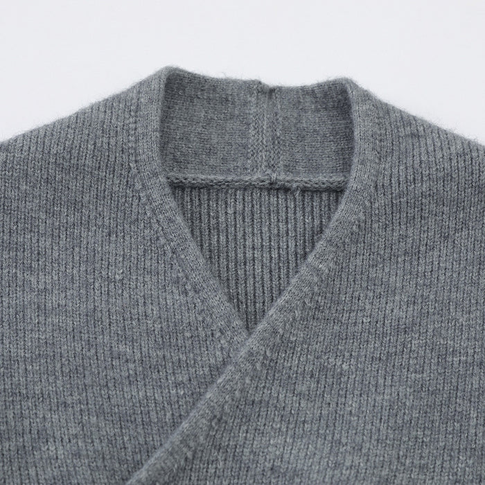 Close-up of the gray cardigan's V-neck collar showing fine ribbed knit texture and inner neckline