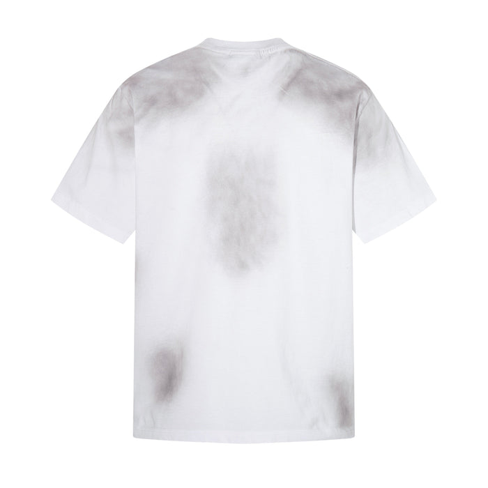 White oversized T-shirt with faded distressed collage print on the back, laid flat against a clean white background