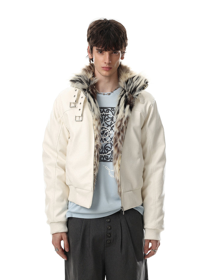 Oversized faux leather bomber jacket with faux fur buckle collar in off-white, worn open over a graphic tee and wide-leg trou