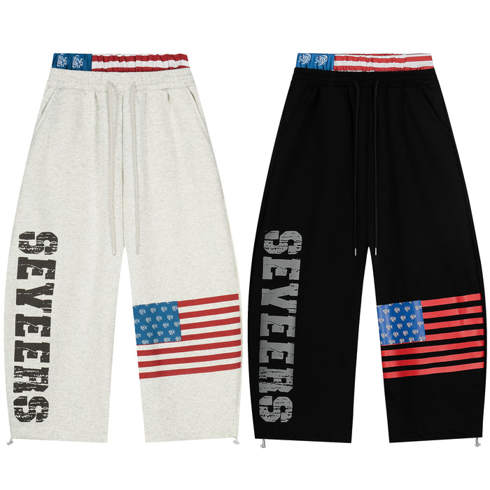 Heather grey and black wide-leg sweatpants with vertical SEVEERS print, American flag graphic, and red white blue waistband