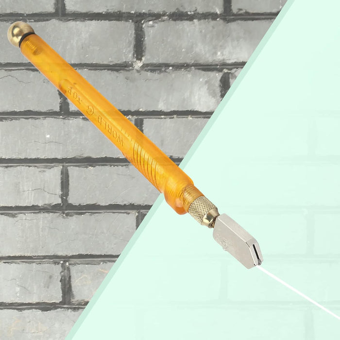 Glass cutter with an amber handle scores a light blue surface with a visible line.glass cutter, scoring tool, WORLD-TOP, hand tool.