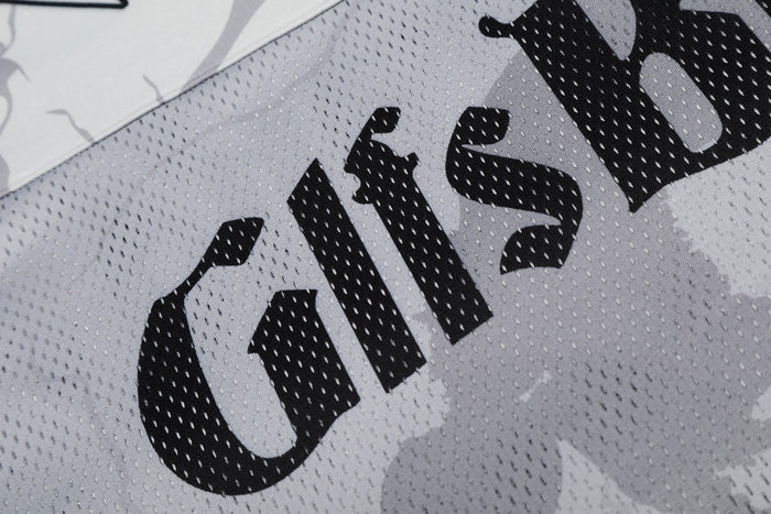 Close-up of a white mesh football jersey with bold black graphic lettering and jersey number 99 print