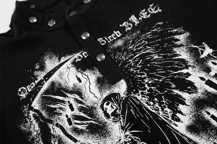 Close-up of black shirt front showing grim reaper print and gothic lettering