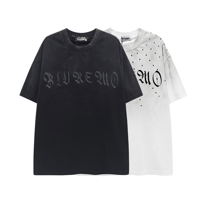 Oversized distressed gothic logo T-shirt in black and white with studded dot details and washed streetwear style