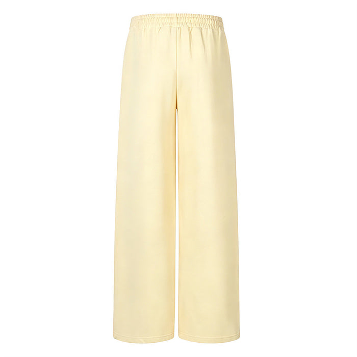 Plain pale yellow wide-leg sweatpants shown from the back with a gathered elastic waistband