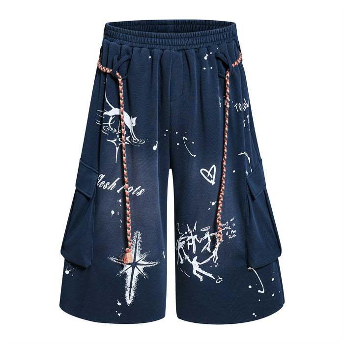 Men's wide-leg graffiti cargo shorts in navy with hand-drawn print, braided rope drawstring, and cargo pockets