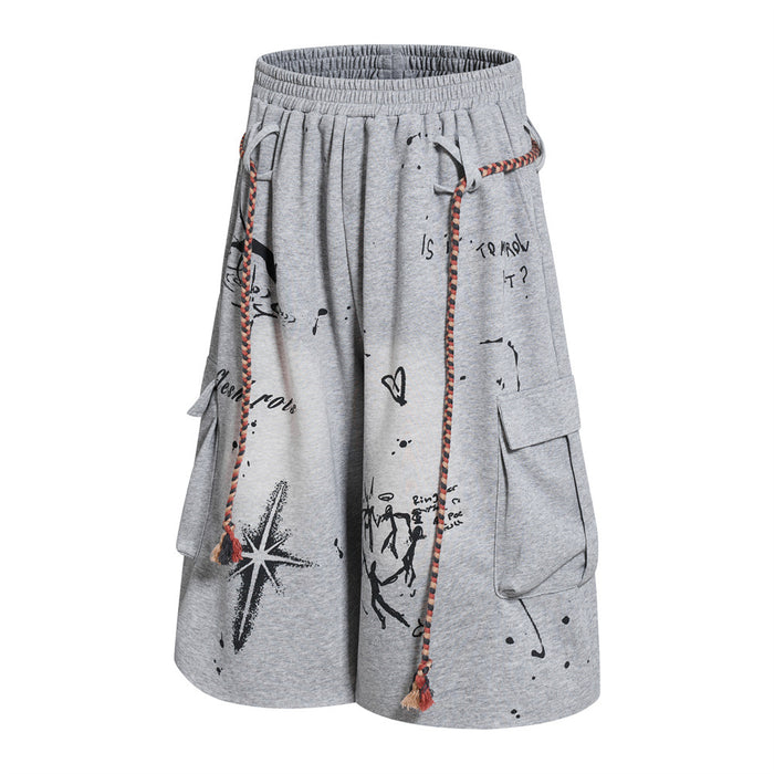Grey graffiti cargo shorts with rope drawstring, angled front view