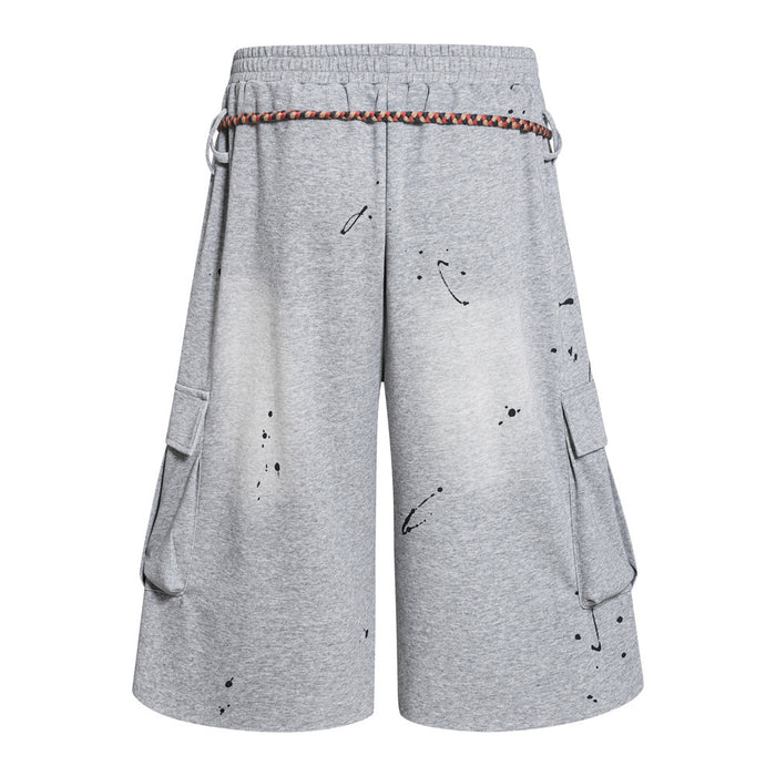 Grey graffiti cargo shorts with rope drawstring, back view