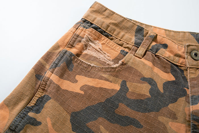 Close-up of front left waist and pocket on camouflage cargo pants